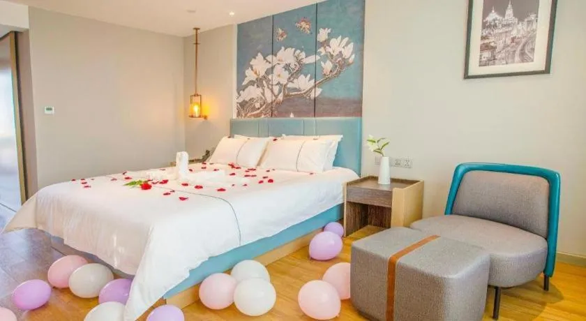 Bed in Magnotel Hotel Dongxing Guomen Port