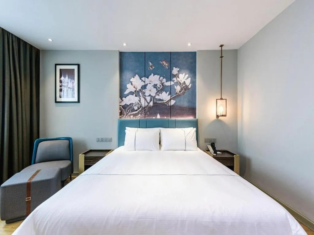 Bed in Magnotel Hotel Dongxing Guomen Port