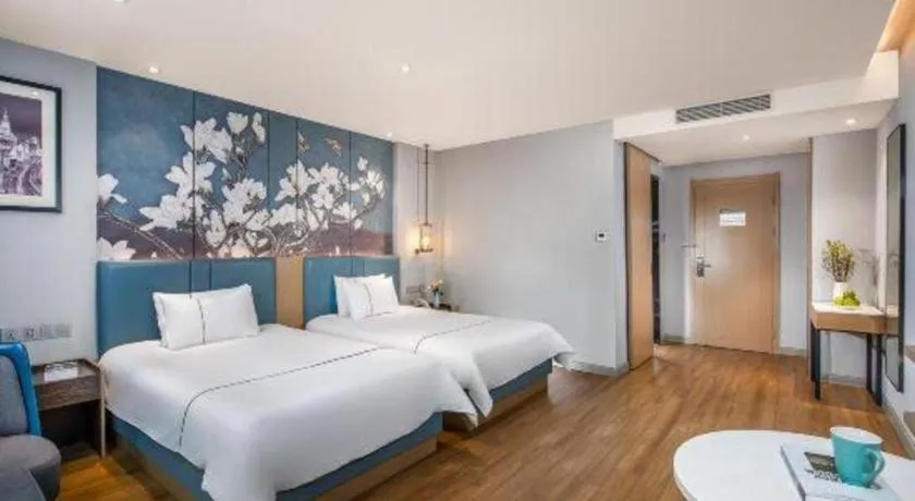 Bed in Magnotel Hotel Dongxing Guomen Port