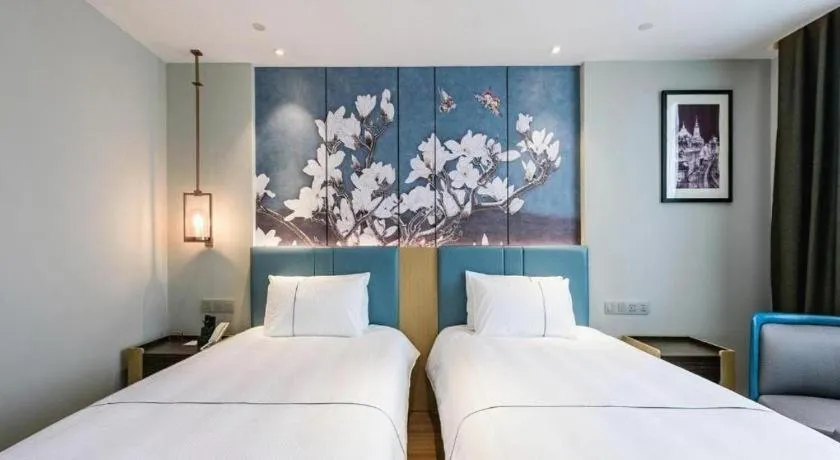 Bed in Magnotel Hotel Dongxing Guomen Port
