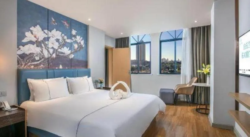 Bed in Magnotel Hotel Dongxing Guomen Port