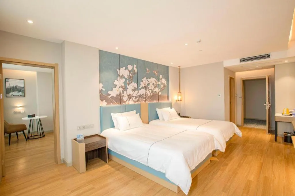 Bed in Magnotel Hotel Dongxing Guomen Port