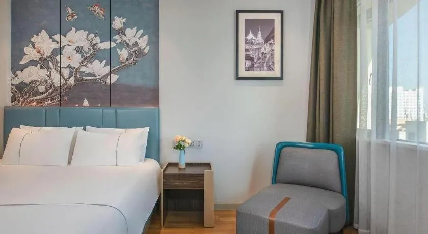 Bed in Magnotel Hotel Dongxing Guomen Port