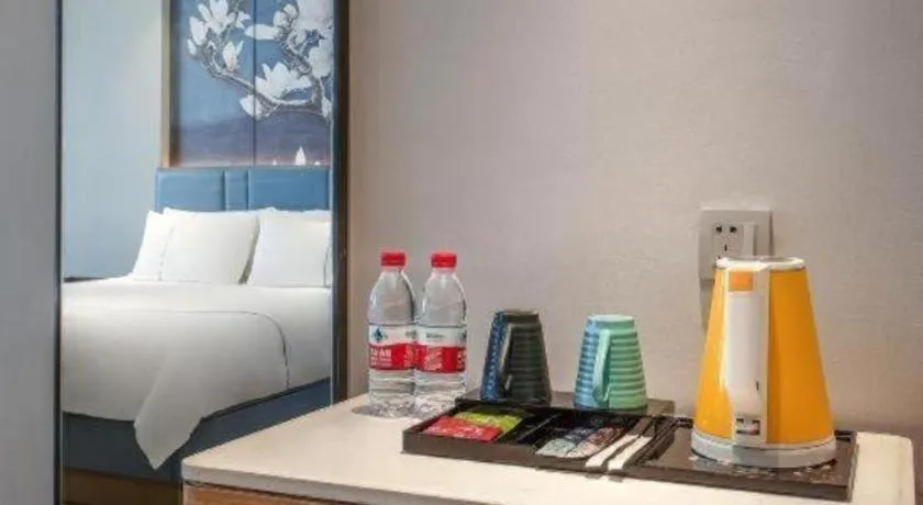 Bed in Magnotel Hotel Dongxing Guomen Port