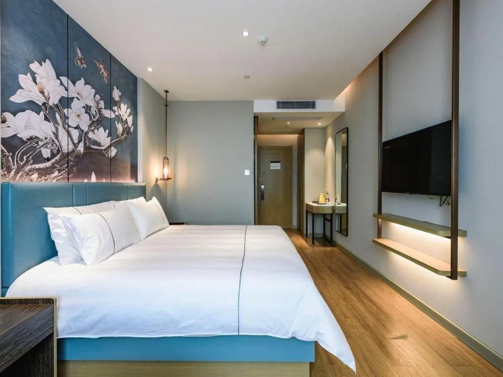 Bed in Magnotel Hotel Dongxing Guomen Port