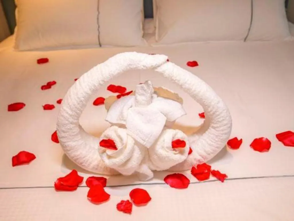 Bed in Magnotel Hotel Dongxing Guomen Port