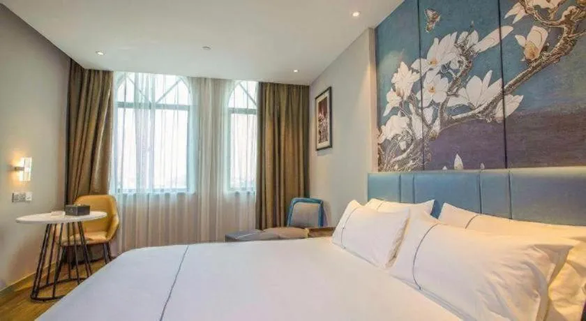 Bed in Magnotel Hotel Dongxing Guomen Port