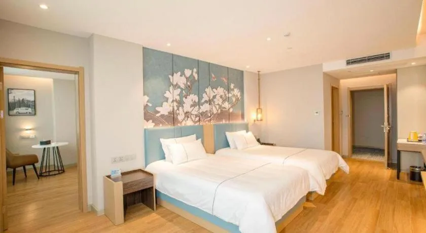 Bed in Magnotel Hotel Dongxing Guomen Port