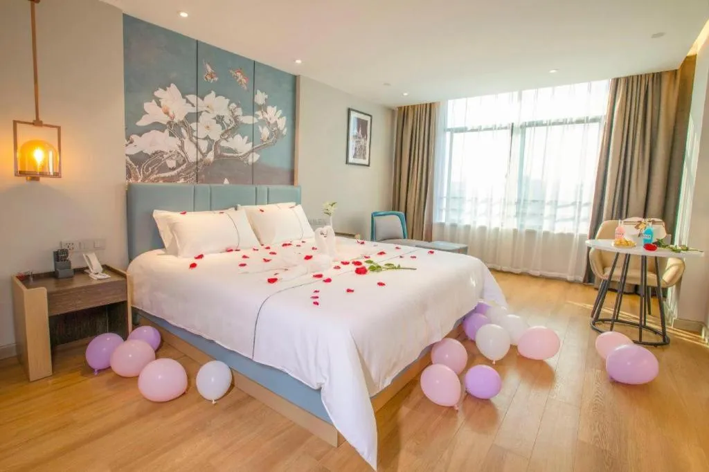 Bed in Magnotel Hotel Dongxing Guomen Port