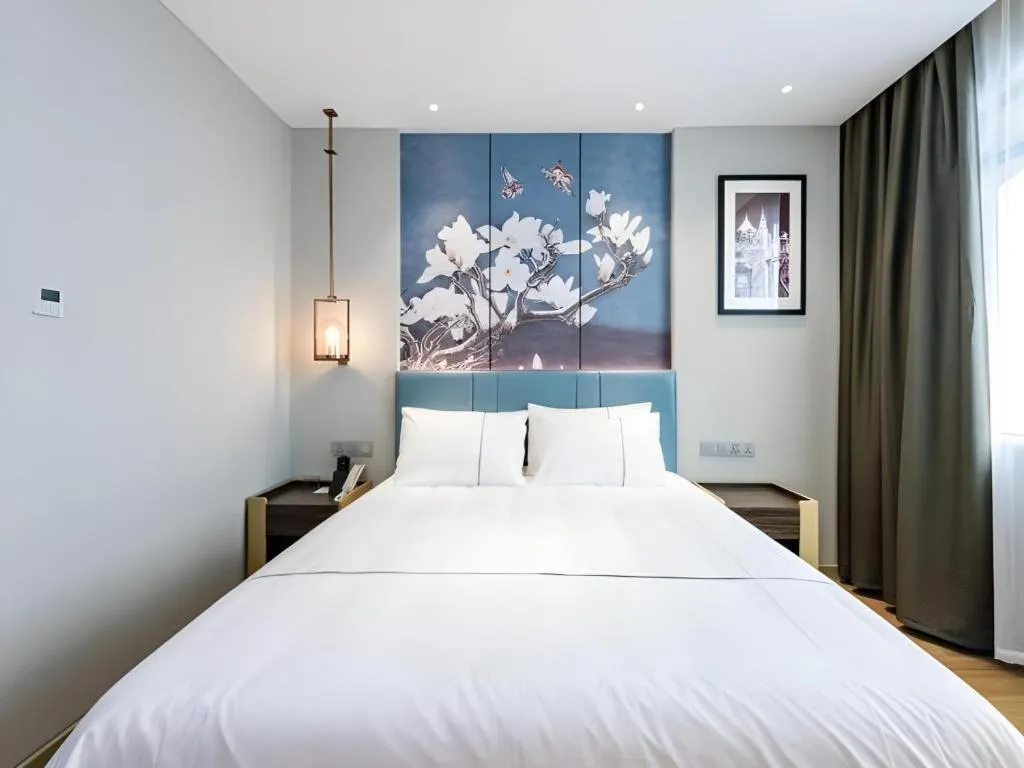 Bed in Magnotel Hotel Dongxing Guomen Port