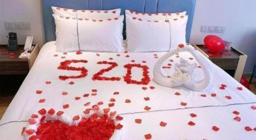 Bed in Magnotel Hotel Dongxing Guomen Port