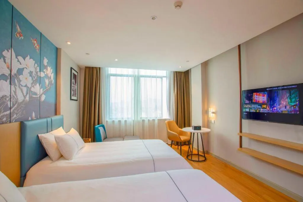 Bed in Magnotel Hotel Dongxing Guomen Port