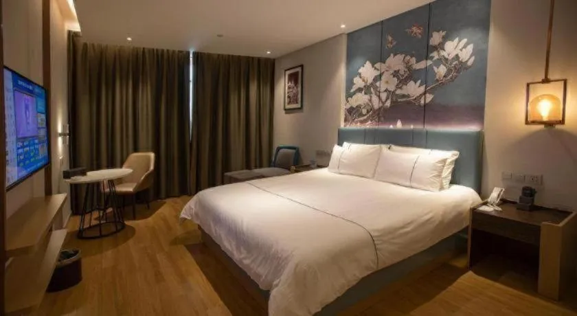 Bed in Magnotel Hotel Dongxing Guomen Port