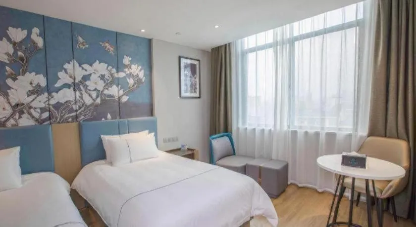 Bed in Magnotel Hotel Dongxing Guomen Port