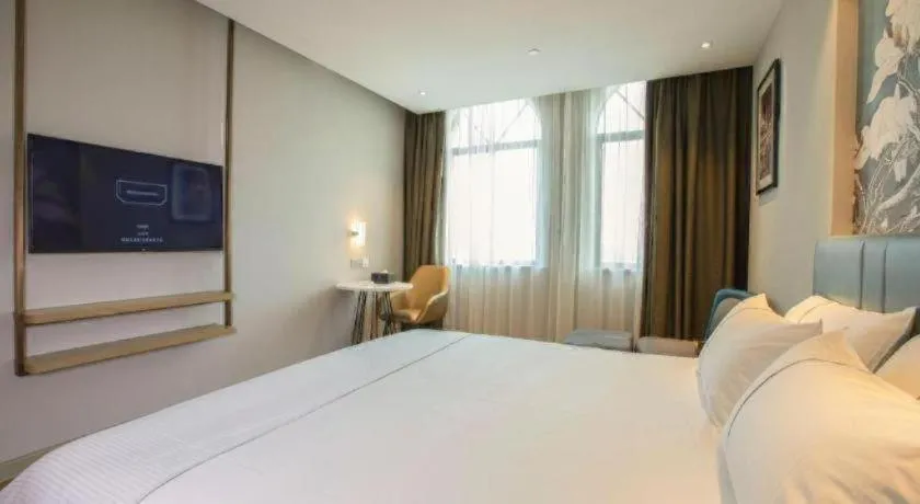 Bed in Magnotel Hotel Dongxing Guomen Port
