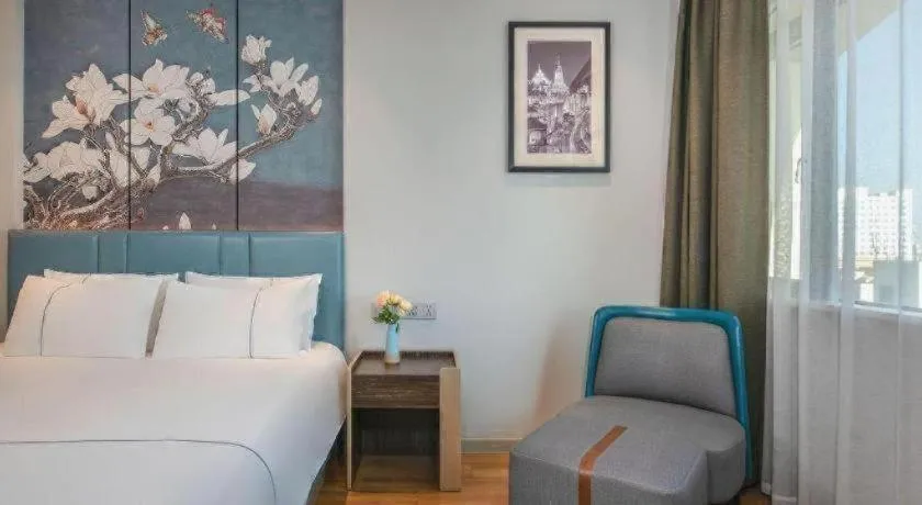 Bed in Magnotel Hotel Dongxing Guomen Port