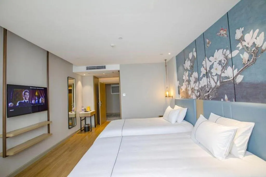 Bed in Magnotel Hotel Dongxing Guomen Port