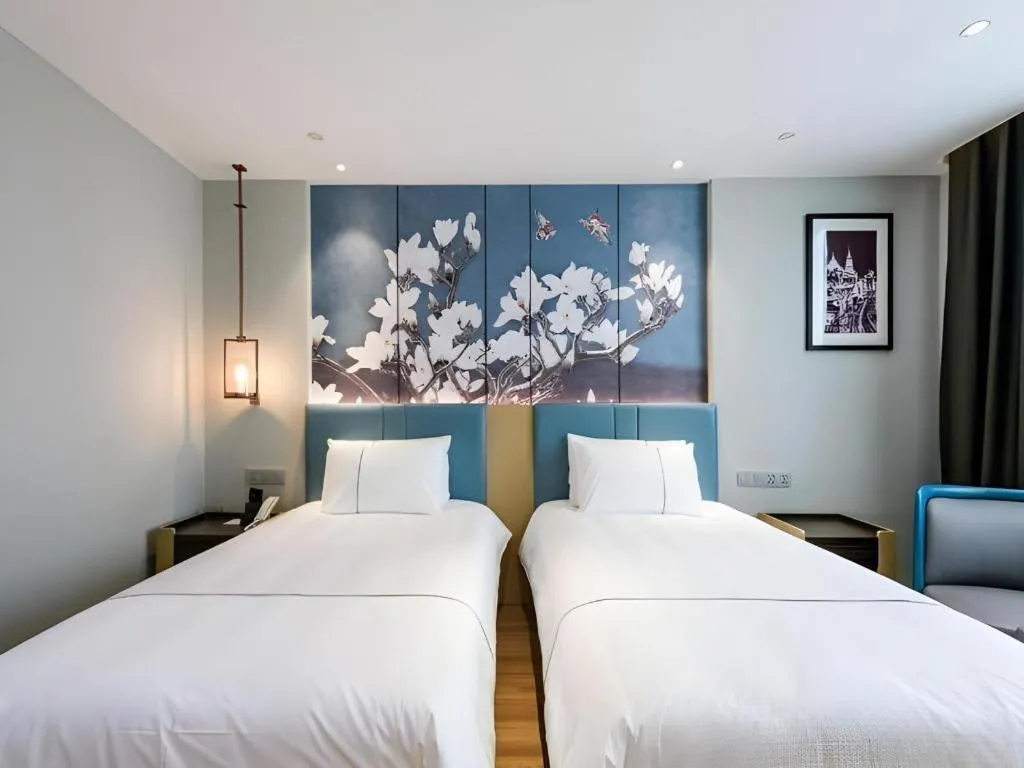 Bed in Magnotel Hotel Dongxing Guomen Port