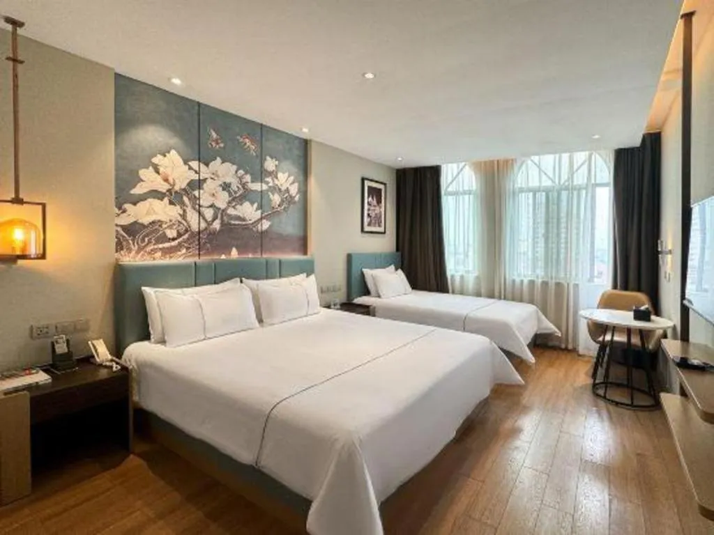 Bed in Magnotel Hotel Dongxing Guomen Port