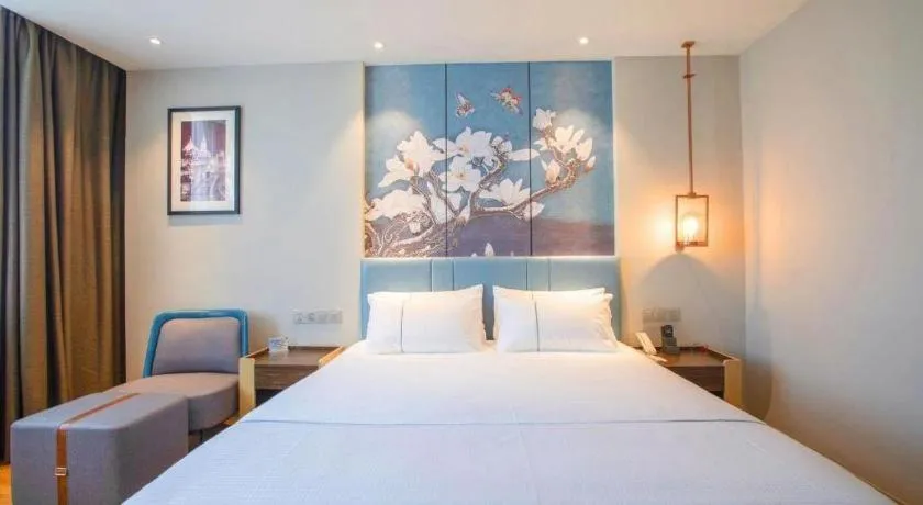 Bed in Magnotel Hotel Dongxing Guomen Port