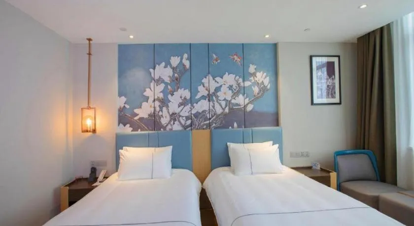 Bed in Magnotel Hotel Dongxing Guomen Port