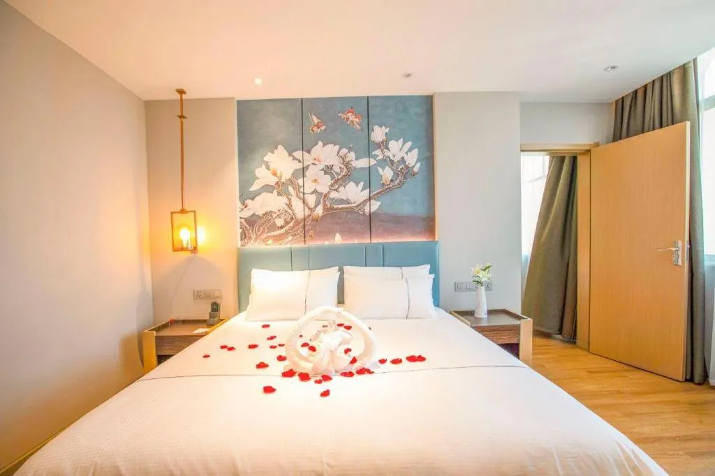 Bed in Magnotel Hotel Dongxing Guomen Port