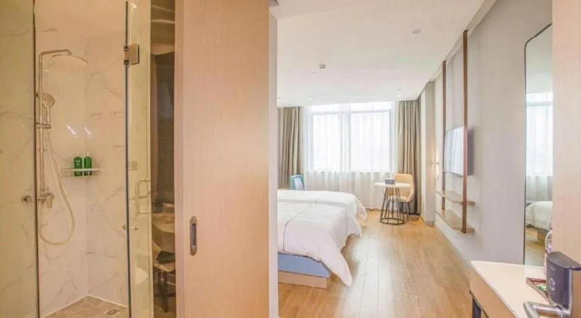 Bed in Magnotel Hotel Dongxing Guomen Port