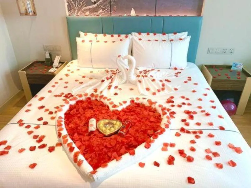 Bed in Magnotel Hotel Dongxing Guomen Port