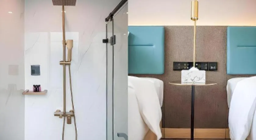 Bed in Zmax Hotel Guangzhou Railway Station