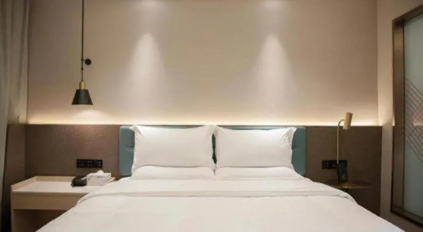 Bed in Zmax Hotel Guangzhou Railway Station