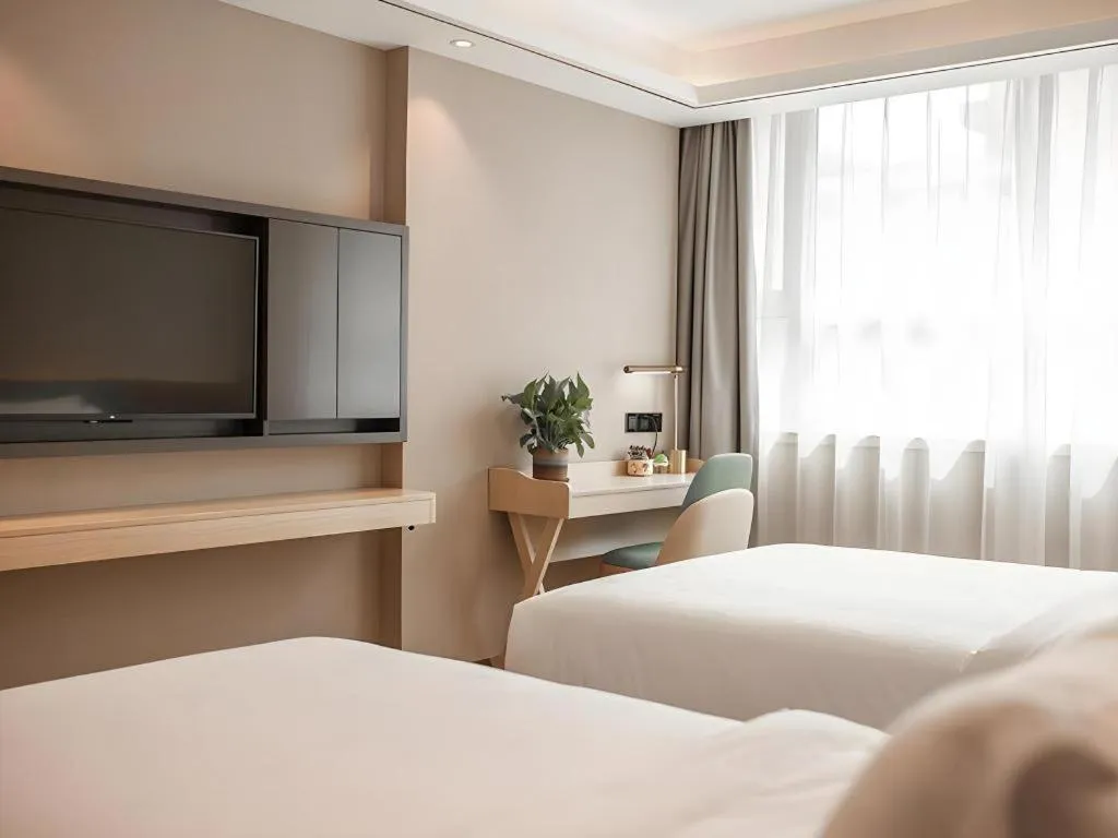 Bed in Zmax Hotel Guangzhou Railway Station