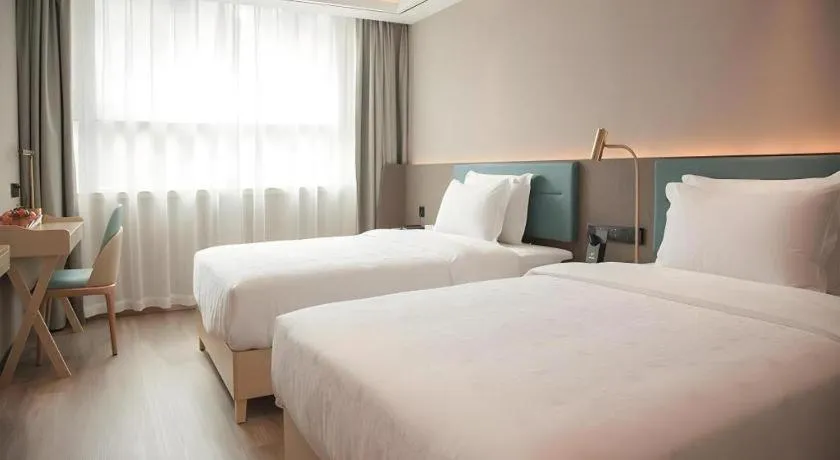 Bed in Zmax Hotel Guangzhou Railway Station