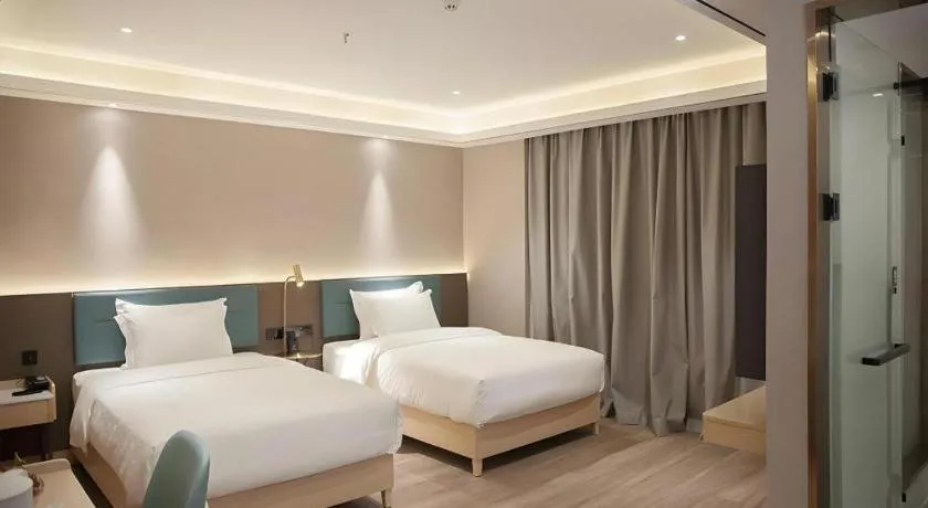 Bed in Zmax Hotel Guangzhou Railway Station