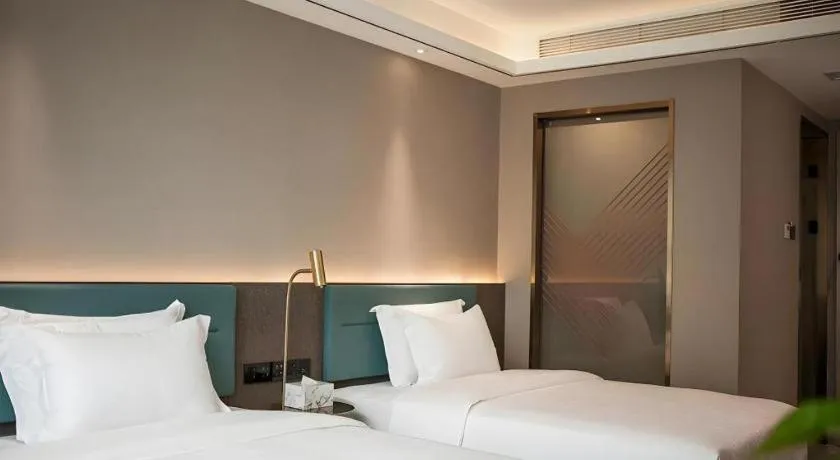 Bed in Zmax Hotel Guangzhou Railway Station