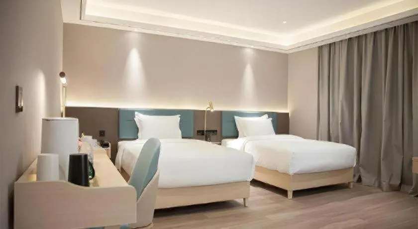 Bed in Zmax Hotel Guangzhou Railway Station