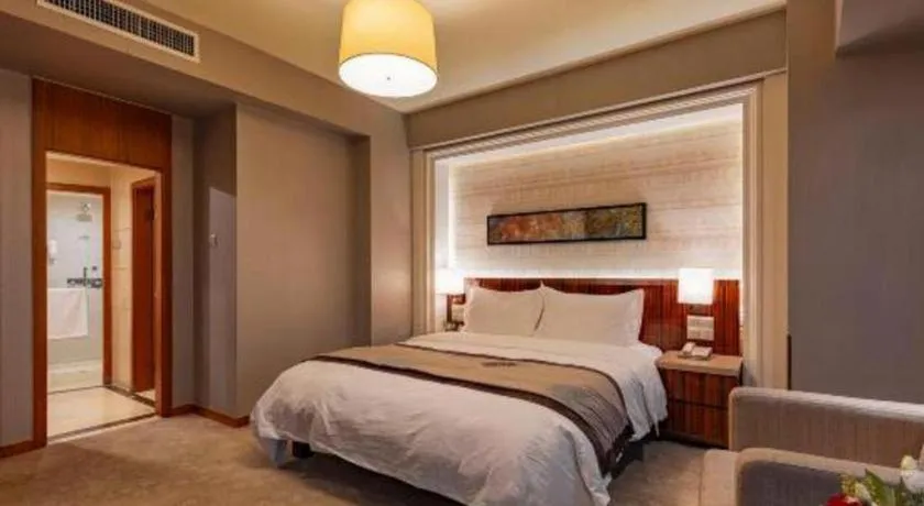 Bed in YUN-RAY Ambassador Hotel