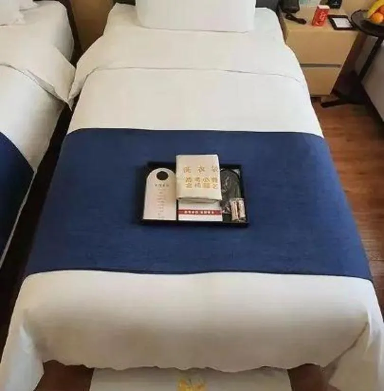 Bed in YUN-RAY Ambassador Hotel