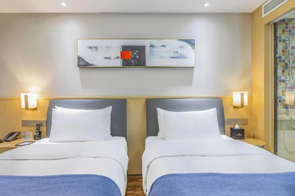 Bed in YUN-RAY Ambassador Hotel