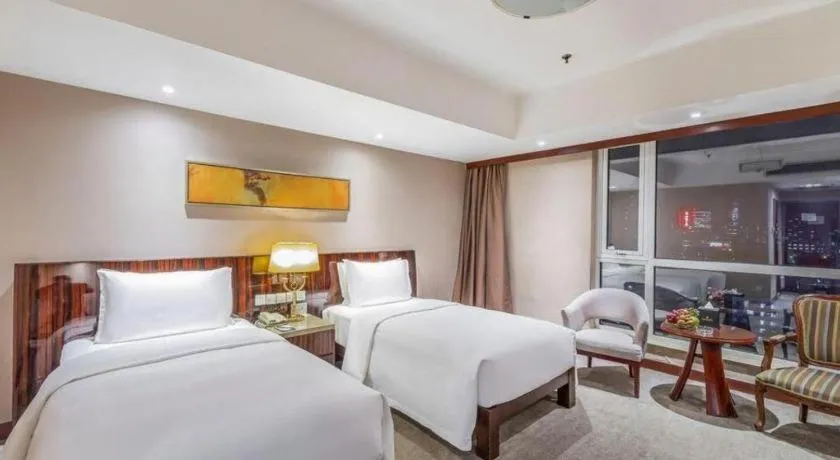 Bed in YUN-RAY Ambassador Hotel