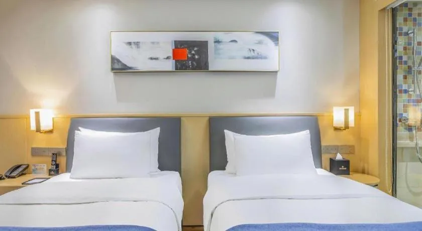 Bed in YUN-RAY Ambassador Hotel