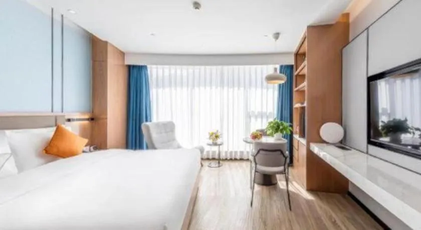 Bed in YUN-RAY Ambassador Hotel