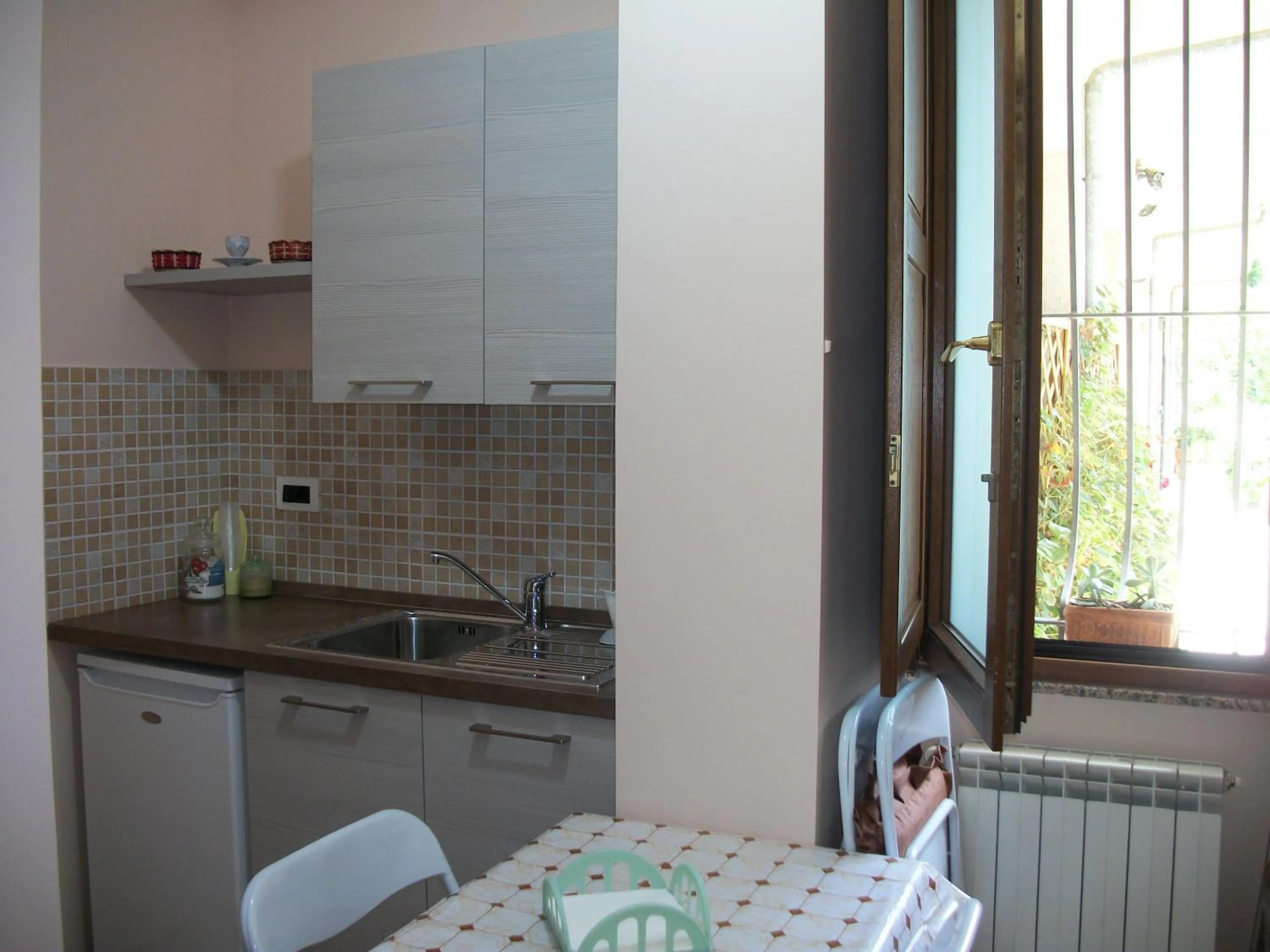 Kitchen or kitchenette in Le Poiane B&B Vacanze