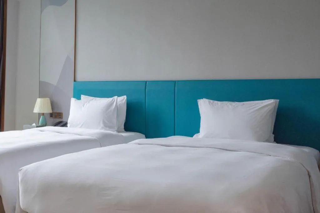 Bed in Zhuhai Hongsanyi Hotel