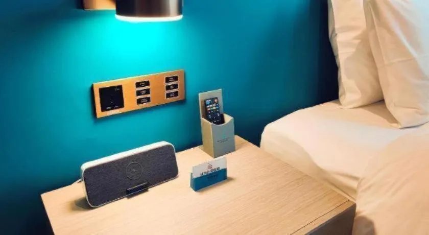 Bed in Zhuhai Hongsanyi Hotel
