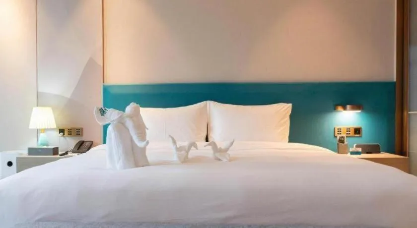 Bed in Zhuhai Hongsanyi Hotel