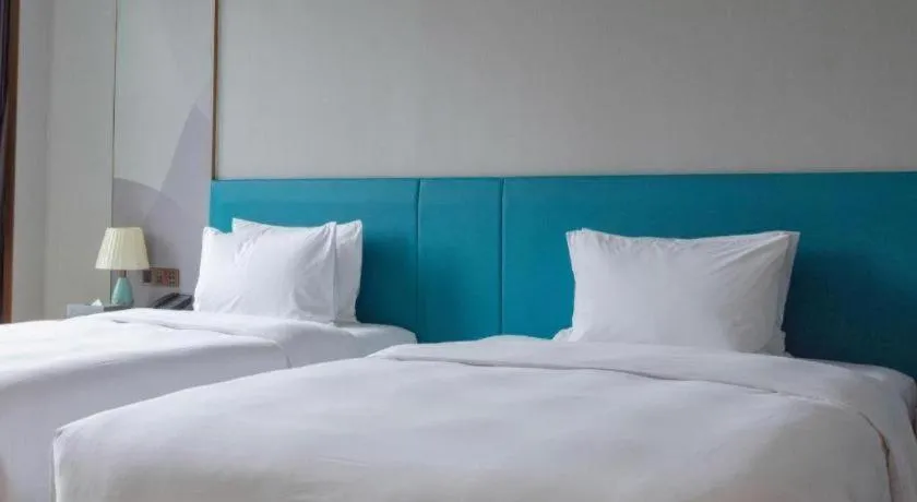 Bed in Zhuhai Hongsanyi Hotel