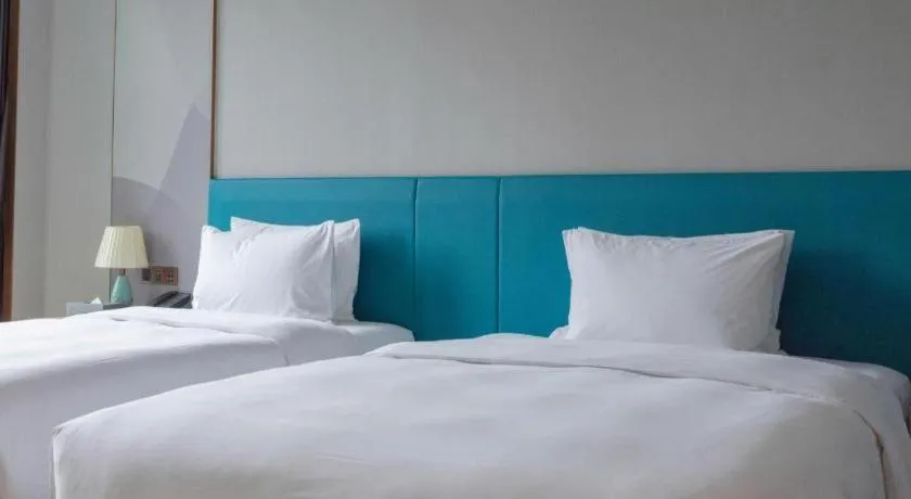 Bed in Zhuhai Hongsanyi Hotel