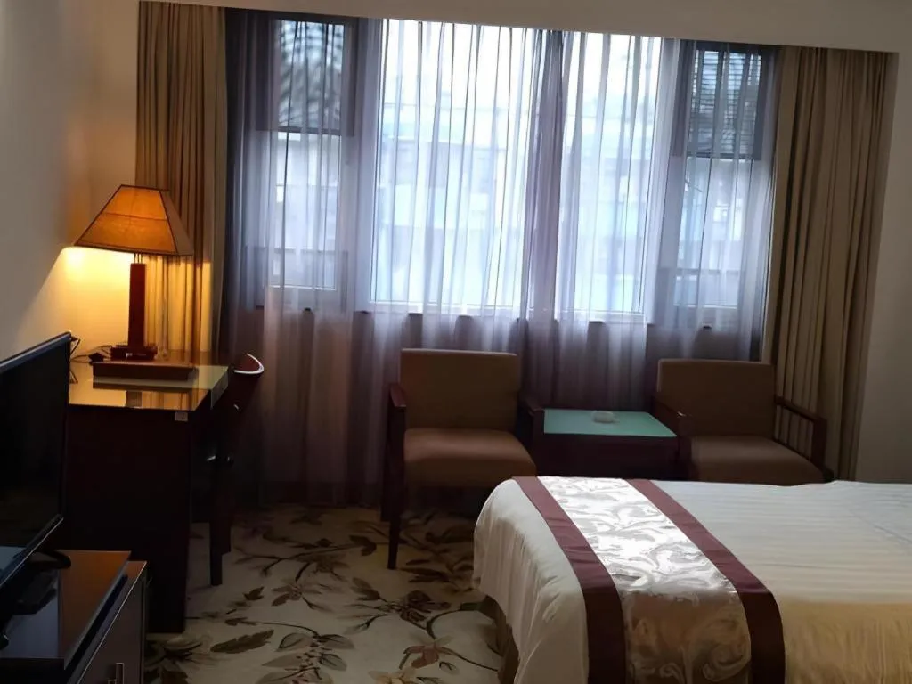 Bed in Hong Ye Hotel