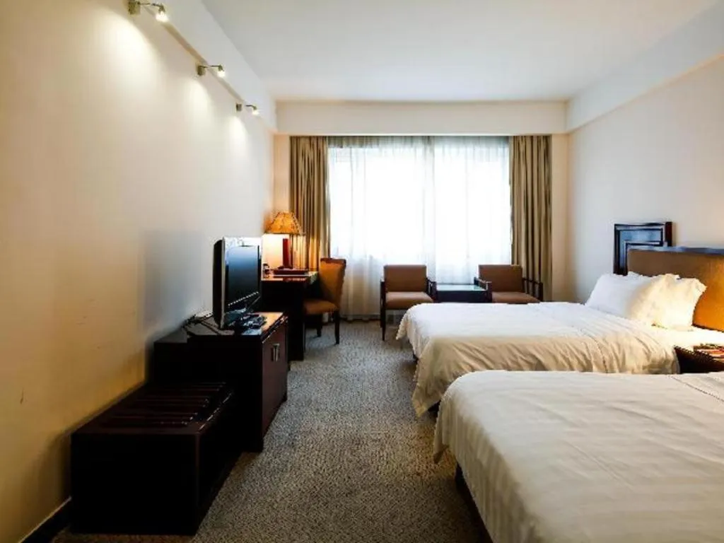 Bed in Hong Ye Hotel