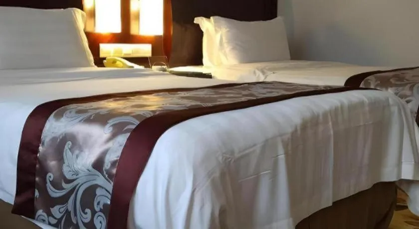 Bed in Hong Ye Hotel